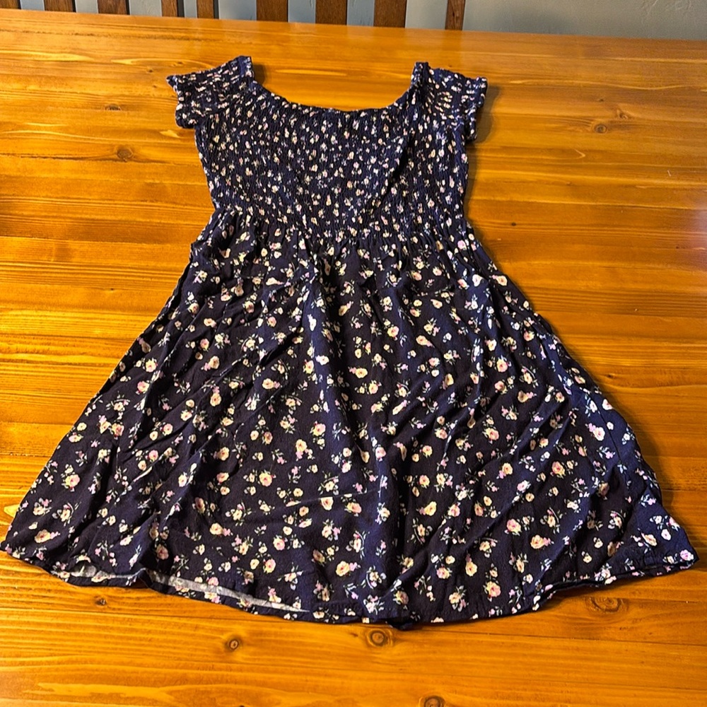Mossimo size small blue sun dress with flowers. Very cute on